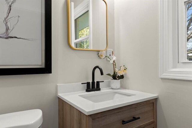 bathroom with vanity and toilet