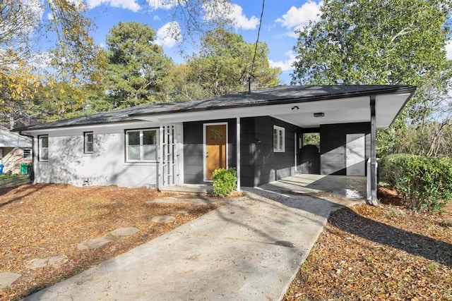 ranch-style house with a carport