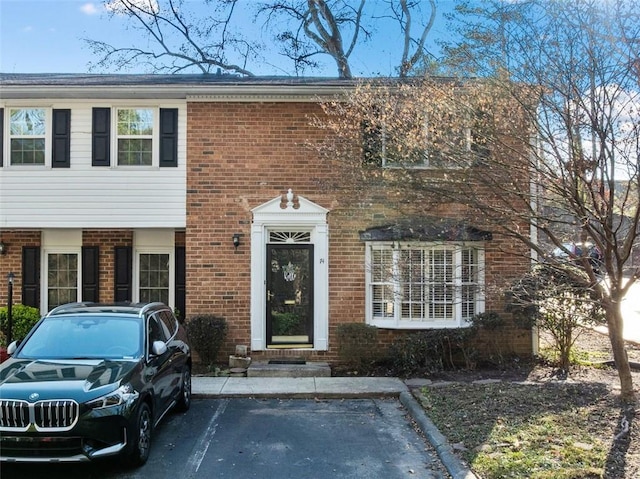 view of front facade featuring brick siding