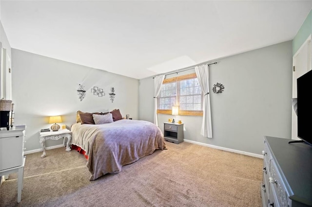 bedroom featuring baseboards and carpet