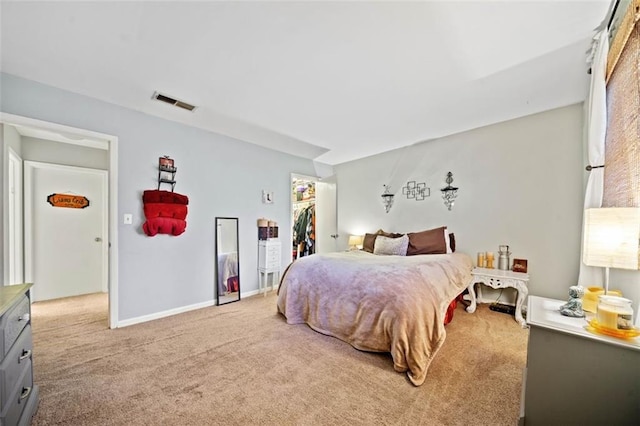 bedroom with visible vents, a walk in closet, baseboards, carpet flooring, and a closet