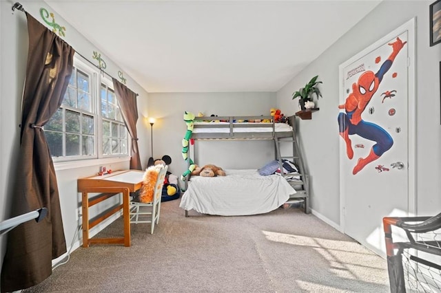 carpeted bedroom featuring baseboards