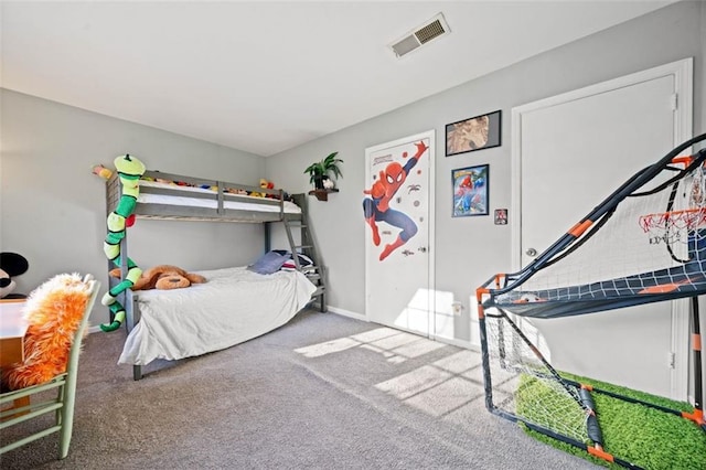 carpeted bedroom with visible vents and baseboards