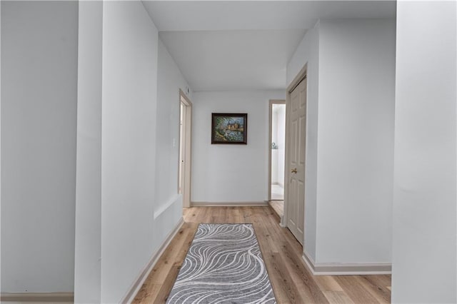 hallway with light wood-style flooring