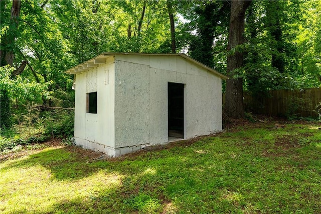 view of shed with a view of trees