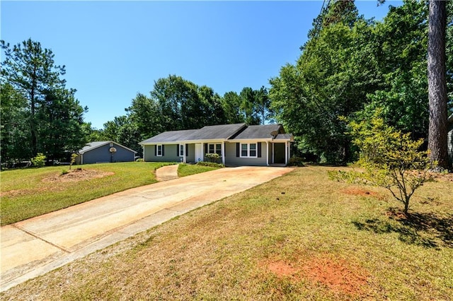 single story home featuring driveway and a front yard