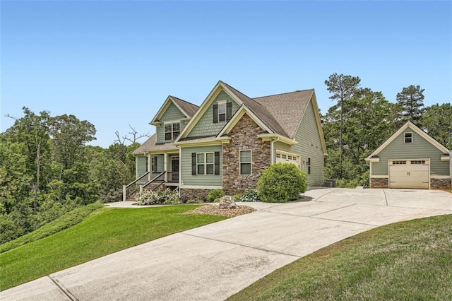 46 Grand Georgian Ct NE, Cartersville, GA 30121 - craftsman-style house featuring stone siding, concrete driveway, a front yard, and a detached garage