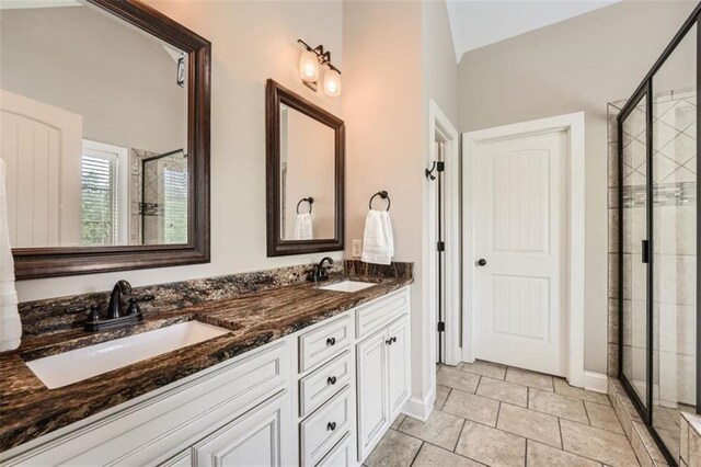 46 Grand Georgian Ct NE, Cartersville, GA 30121 - full bath featuring a shower stall, double vanity, vaulted ceiling, tile patterned flooring, and baseboards