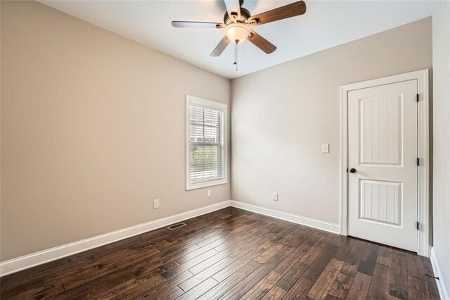 46 Grand Georgian Ct NE, Cartersville, GA 30121 - spare room featuring dark wood-style flooring, ceiling fan, and baseboards