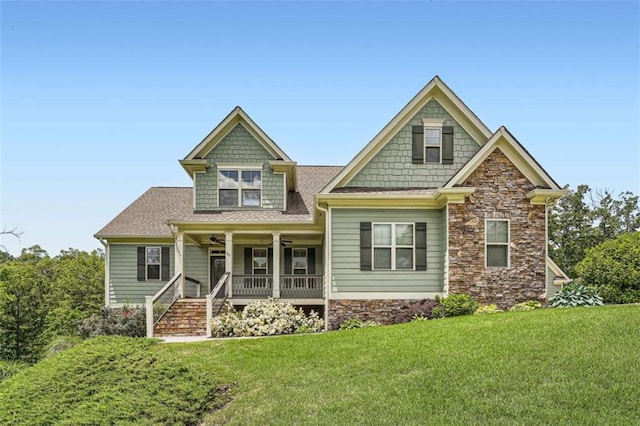 46 Grand Georgian Ct NE, Cartersville, GA 30121 - craftsman-style home featuring covered porch, a front yard, stone siding, and ceiling fan