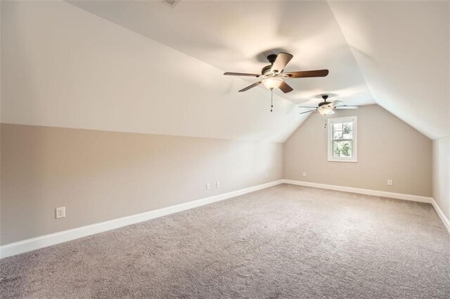 46 Grand Georgian Ct NE, Cartersville, GA 30121 - additional living space featuring ceiling fan, carpet, vaulted ceiling, and baseboards