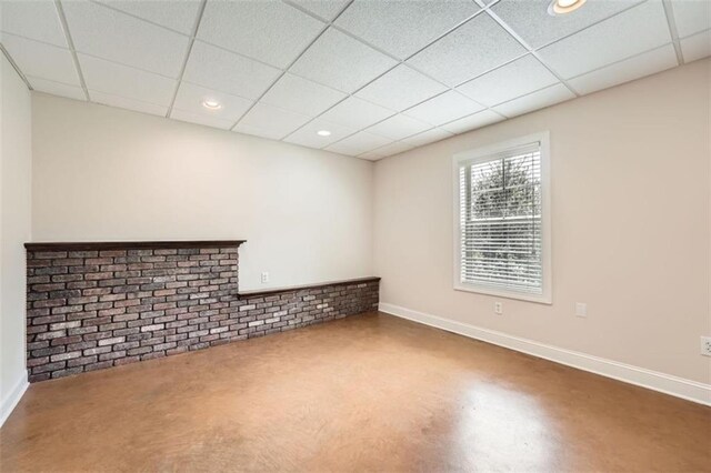 46 Grand Georgian Ct NE, Cartersville, GA 30121 - spare room with baseboards, a drop ceiling, recessed lighting, and finished concrete floors