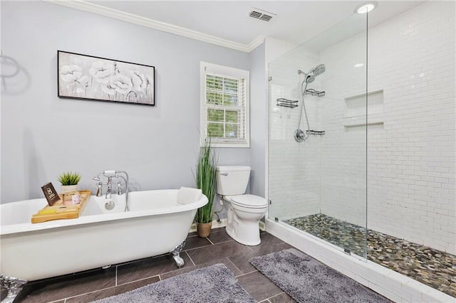 full bathroom with crown molding, a tile shower, toilet, and visible vents