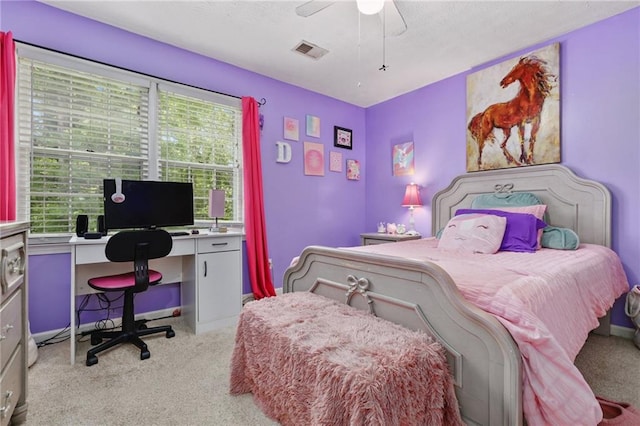 bedroom featuring ceiling fan, visible vents, and carpet