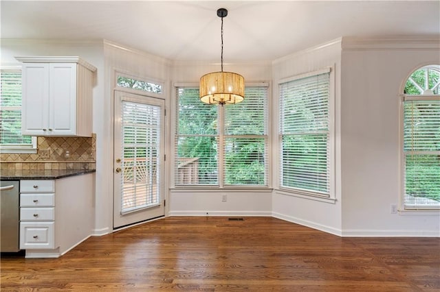 915 Summer Wind Pl, Roswell, GA 30075 - unfurnished dining area featuring wood finished floors, crown molding, baseboards, and a chandelier