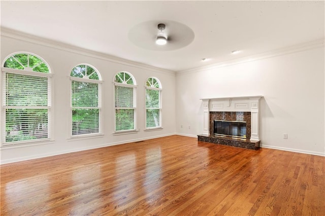 915 Summer Wind Pl, Roswell, GA 30075 - unfurnished living room featuring ornamental molding, wood finished floors, a high end fireplace, ceiling fan, and baseboards
