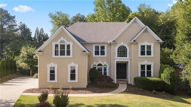915 Summer Wind Pl, Roswell, GA 30075 - view of front facade featuring stucco siding, a front lawn, and driveway