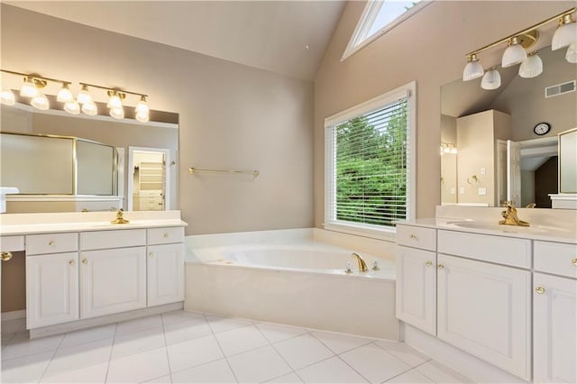 915 Summer Wind Pl, Roswell, GA 30075 - bathroom with a bath, two vanities, a shower stall, high vaulted ceiling, and tile patterned flooring