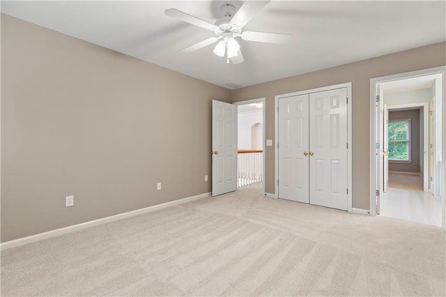 915 Summer Wind Pl, Roswell, GA 30075 - unfurnished bedroom with light colored carpet, baseboards, a closet, and a ceiling fan