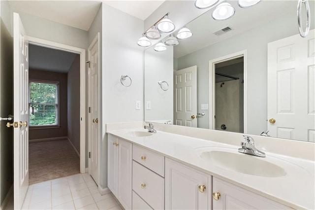 915 Summer Wind Pl, Roswell, GA 30075 - full bath featuring double vanity, a shower, baseboards, and tile patterned flooring