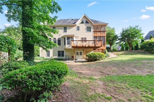915 Summer Wind Pl, Roswell, GA 30075 - back of house featuring a wooden deck, a sunroom, and a yard