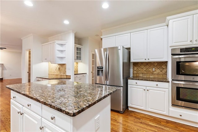915 Summer Wind Pl, Roswell, GA 30075 - kitchen featuring appliances with stainless steel finishes, open shelves, crown molding, tasteful backsplash, and white cabinetry