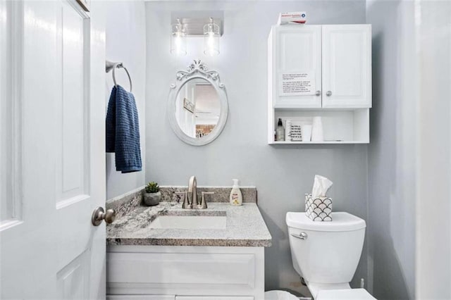 bathroom with vanity and toilet