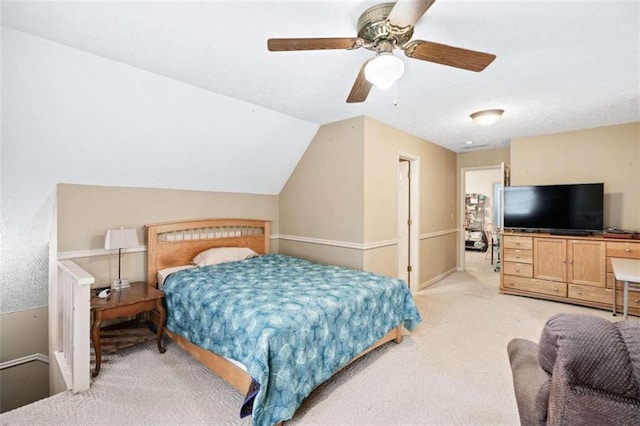 carpeted bedroom featuring ceiling fan and lofted ceiling