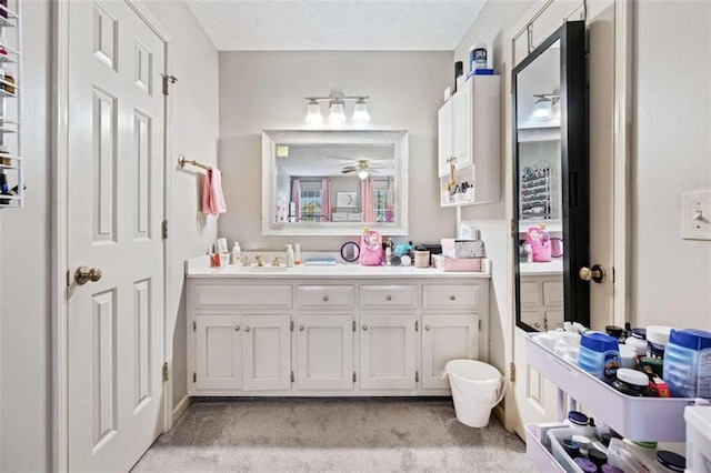 bathroom featuring vanity and a textured ceiling