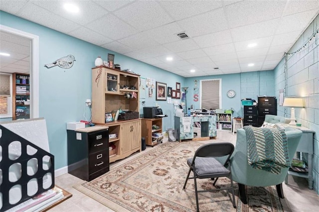 tiled office with a drop ceiling