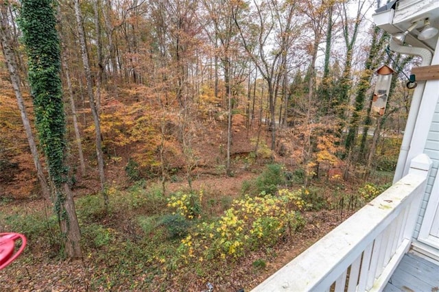 view of yard with a balcony