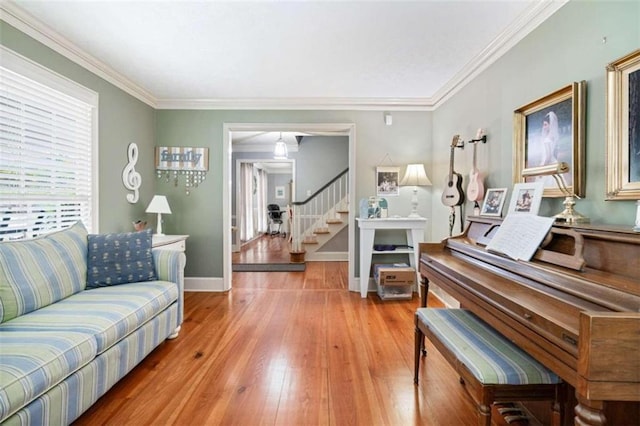 living room with crown molding and wood-type flooring