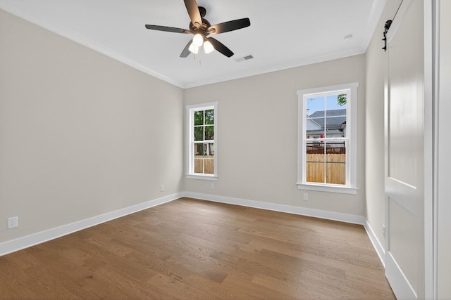 305 Milledge Ave, Monroe, GA 30655 - unfurnished room featuring crown molding, light wood-type flooring, and ceiling fan