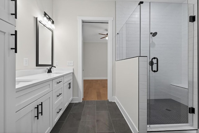 305 Milledge Ave, Monroe, GA 30655 - bathroom with double vanity, a shower stall, a ceiling fan, and tile patterned flooring