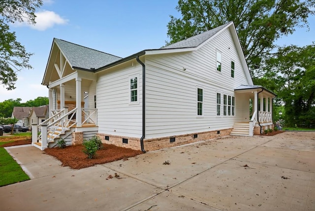 305 Milledge Ave, Monroe, GA 30655 - view of side of home with crawl space, roof with shingles, and covered porch