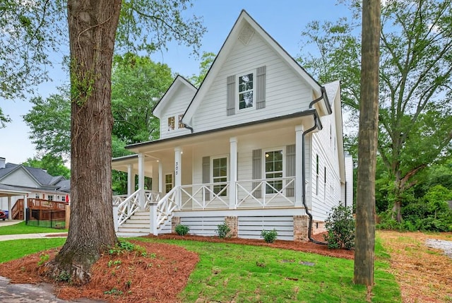 305 Milledge Ave, Monroe, GA 30655 - view of front of property with covered porch and a front yard