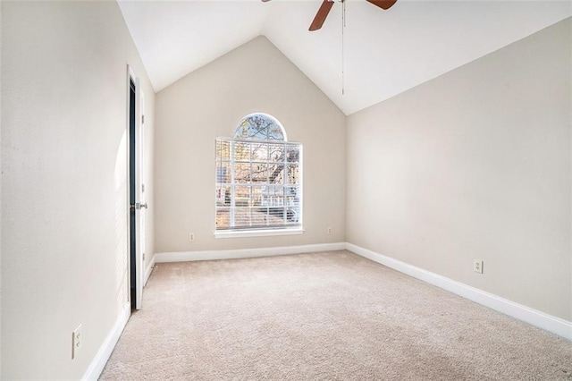 unfurnished room with light colored carpet, vaulted ceiling, and ceiling fan