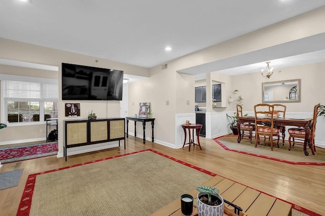 4081 Riverlook Pkwy SE Unit 13, Marietta, GA 30067 - living room with wood finished floors, a chandelier, and recessed lighting