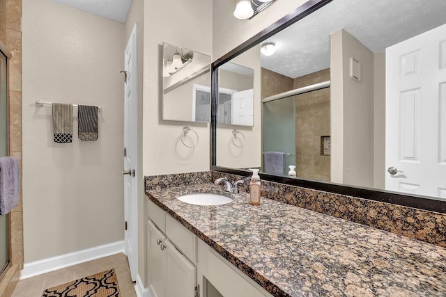 4081 Riverlook Pkwy SE Unit 13, Marietta, GA 30067 - full bath with a stall shower, vanity, a textured ceiling, and tile patterned floors