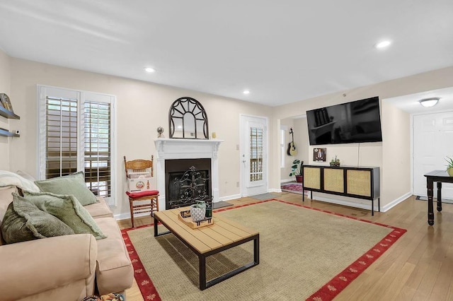 4081 Riverlook Pkwy SE Unit 13, Marietta, GA 30067 - living room featuring a fireplace, recessed lighting, and wood finished floors