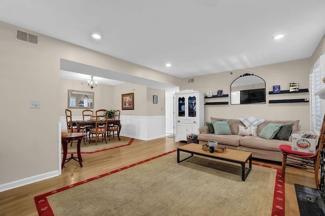 4081 Riverlook Pkwy SE Unit 13, Marietta, GA 30067 - living room featuring wood finished floors, wainscoting, a chandelier, and recessed lighting