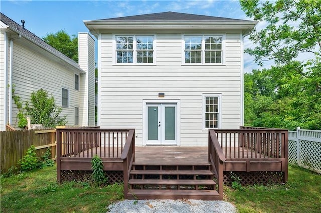 back of property featuring french doors, fence, and a wooden deck