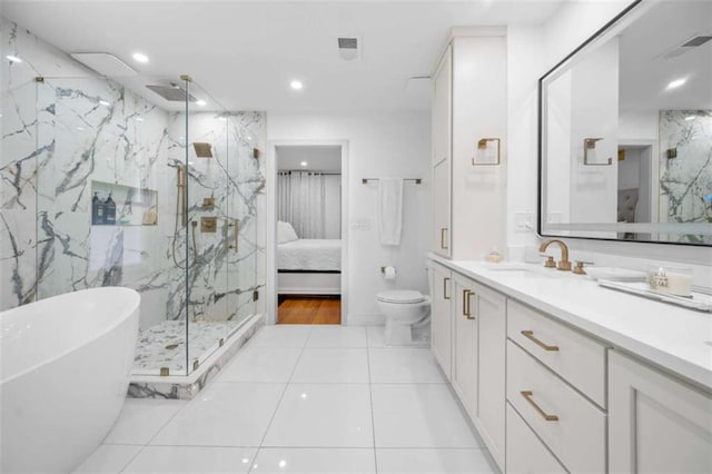 2021 Sherwood Dr SE, Marietta, GA 30062 - bathroom featuring a marble finish shower, a freestanding tub, vanity, connected bathroom, and recessed lighting