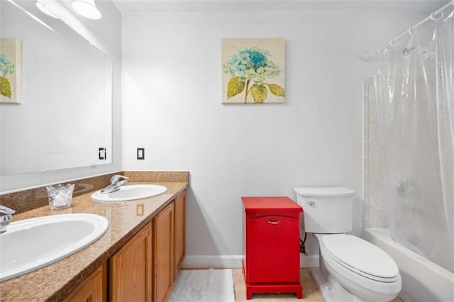 2021 Sherwood Dr SE, Marietta, GA 30062 - full bath with shower / tub combo with curtain, toilet, double vanity, and baseboards
