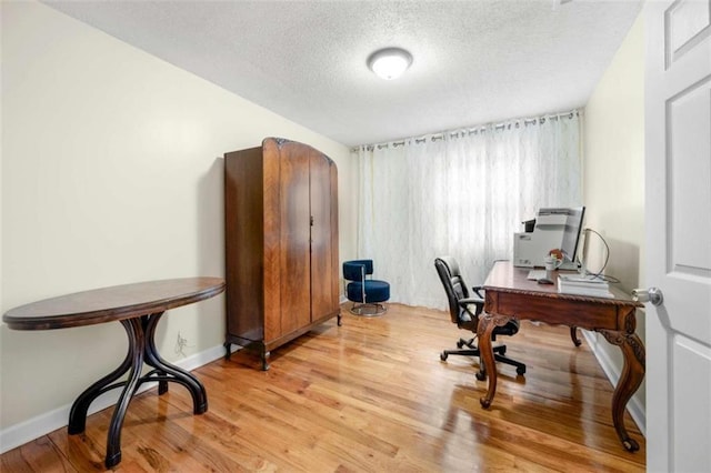 2021 Sherwood Dr SE, Marietta, GA 30062 - office with a textured ceiling, light wood-style floors, and baseboards