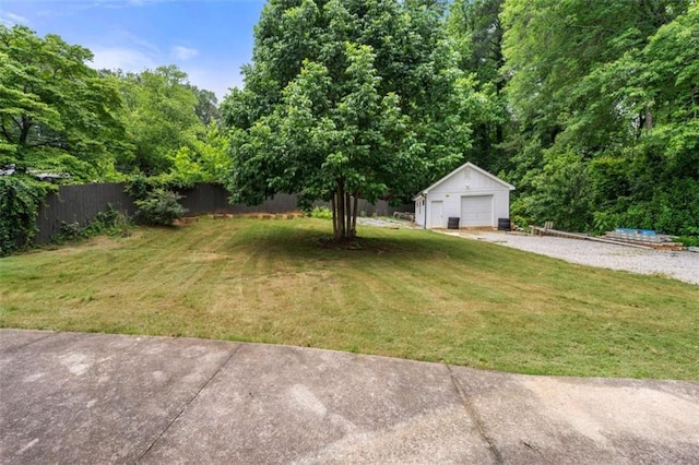 2021 Sherwood Dr SE, Marietta, GA 30062 - view of yard with an outbuilding, a detached garage, and driveway
