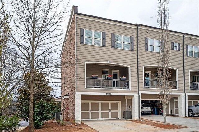 2026 Forte Ln, Alpharetta, GA 30009 - view of front of home featuring driveway, a garage, and central AC unit