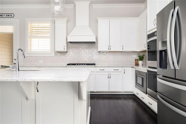 2026 Forte Ln, Alpharetta, GA 30009 - kitchen with stainless steel appliances, premium range hood, a sink, white cabinetry, and ornamental molding