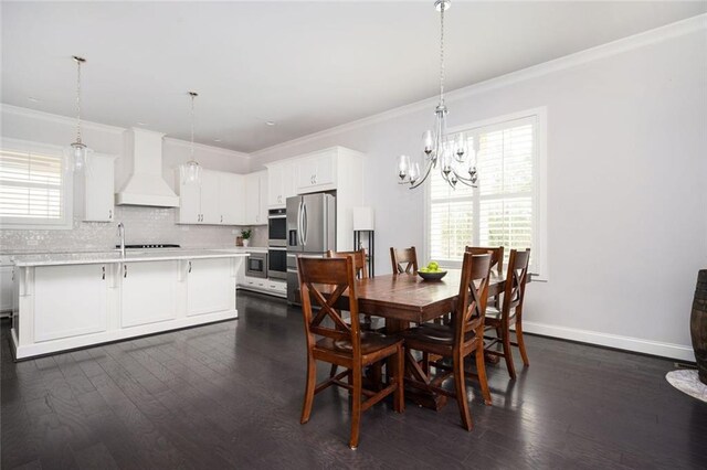 2026 Forte Ln, Alpharetta, GA 30009 - dining area featuring a chandelier, ornamental molding, dark wood finished floors, and baseboards