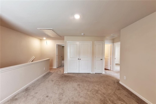 513 Moline Way, Locust Grove, GA 30248 - unfurnished bedroom featuring attic access, carpet flooring, a closet, and baseboards